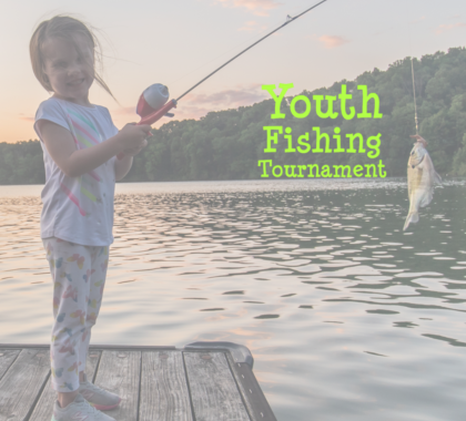 Young Girl standing on pier with fish on line