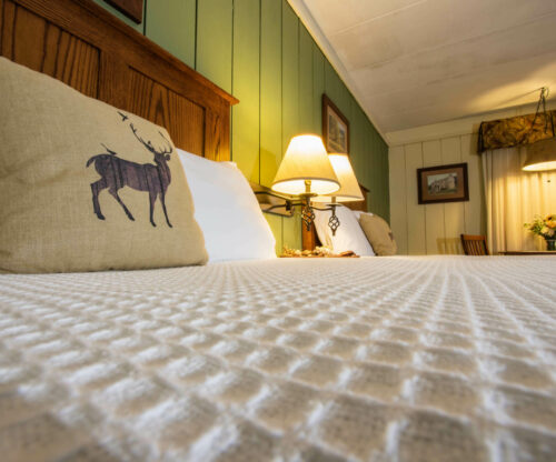 Close up of comfortable bedding in lodge room