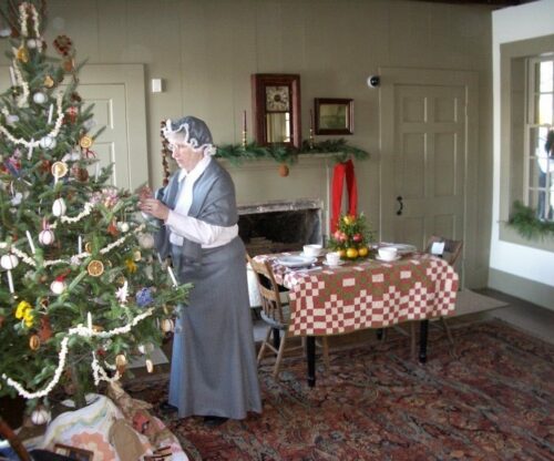 Woman decorating a Christmas Tree