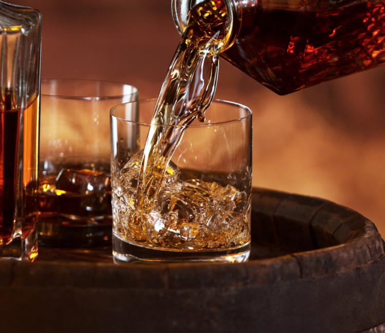 Bourbon being poured on the rocks