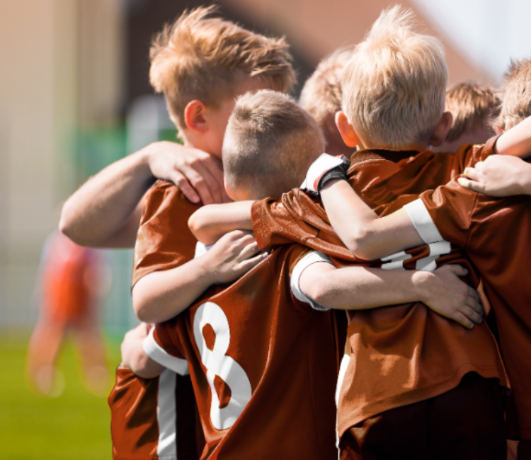 photo of soccer players in a huddle